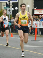 Larry at the finish line of the TC10k